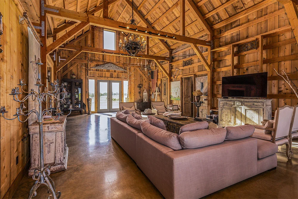 Spacious common area with couches and rafters