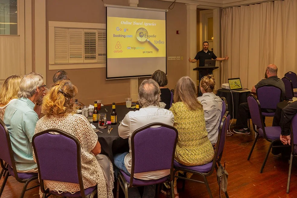 ResNexus presenting a slideshow to gathered innkeepers at a dinner in Brenham, Texas