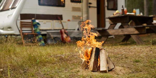 campfire outside a camper