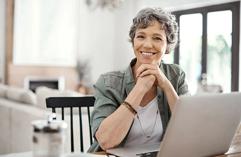 smiling woman at laptop