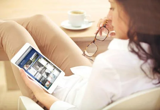 relaxed lady viewing resnexus on her tablet