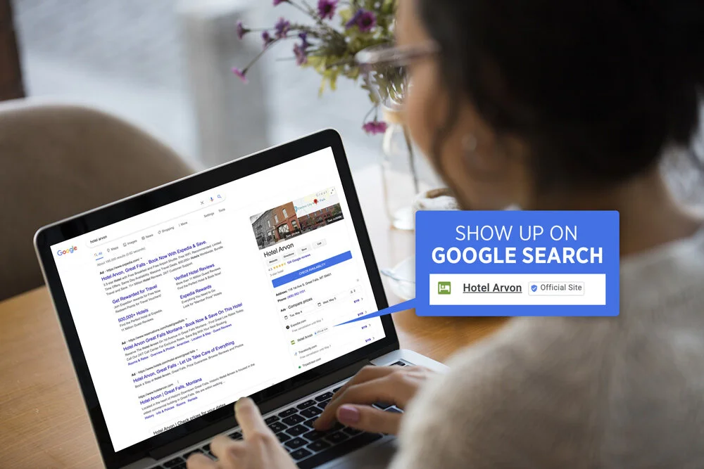 woman on laptop looking a google hotel search