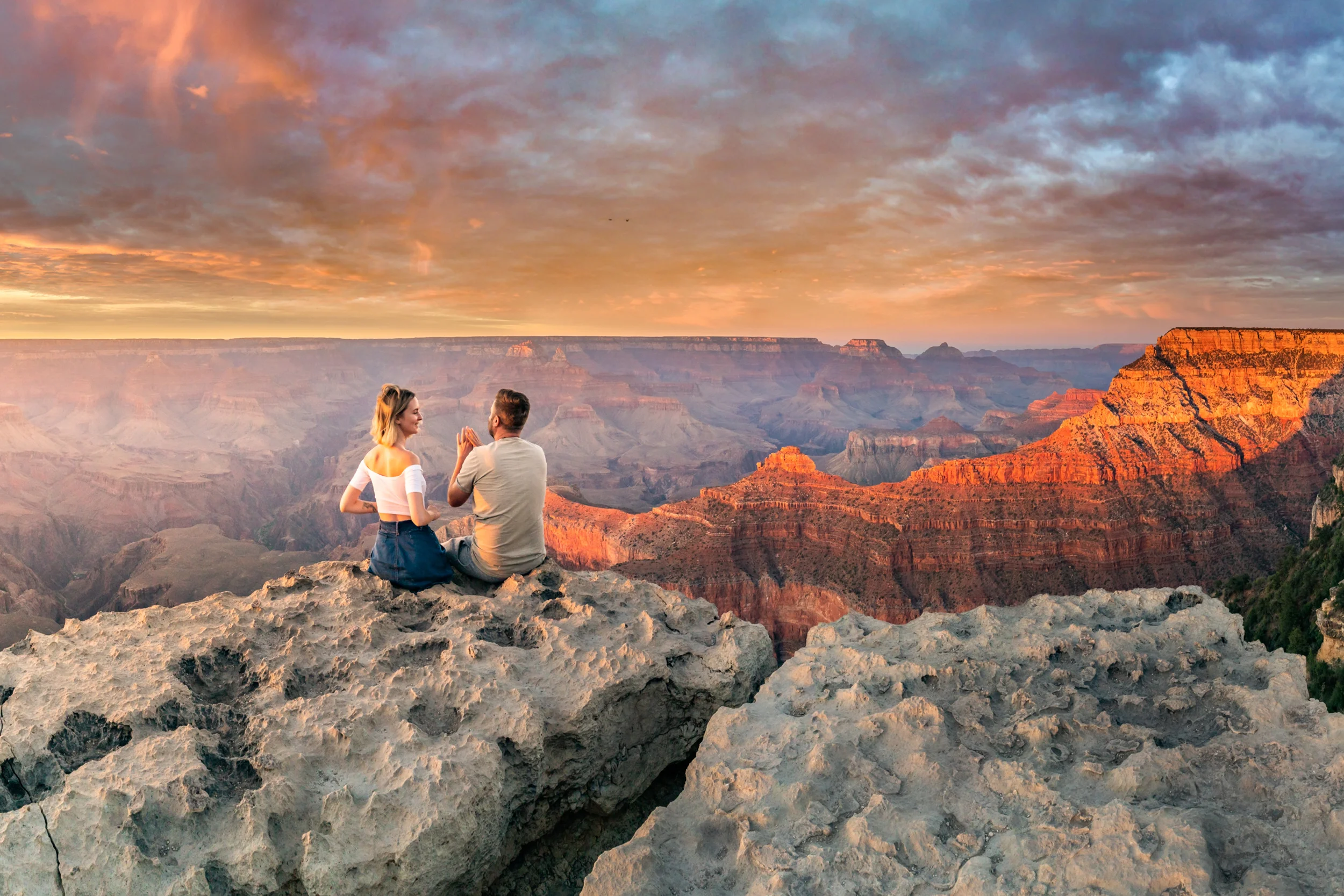 Couple looking at Grand Canyon