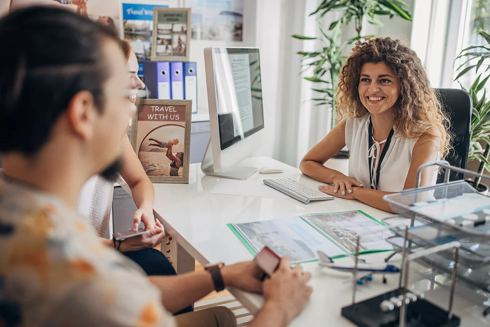 Travel Agent talking to clients