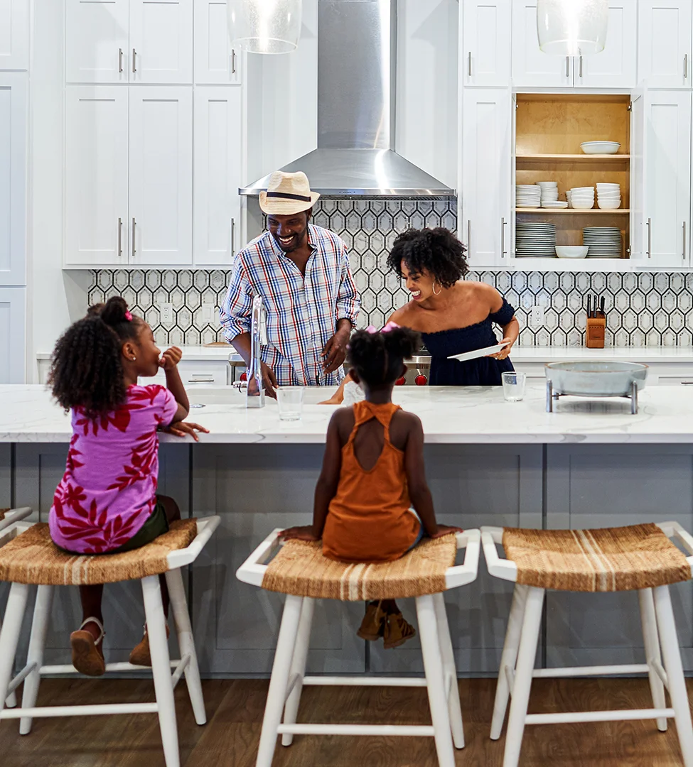 black family making dinner in vacation rental kitchen