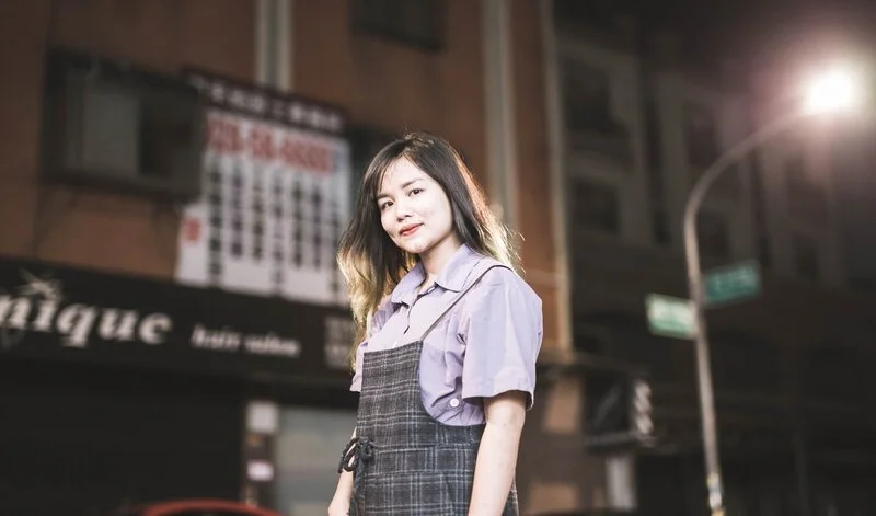 woman wearing apron looking at camera