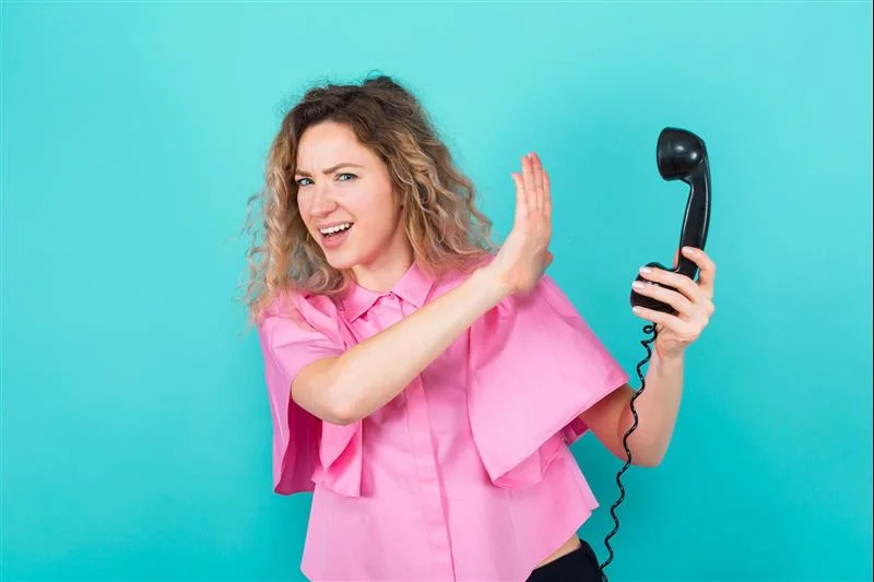 woman hand up to phone