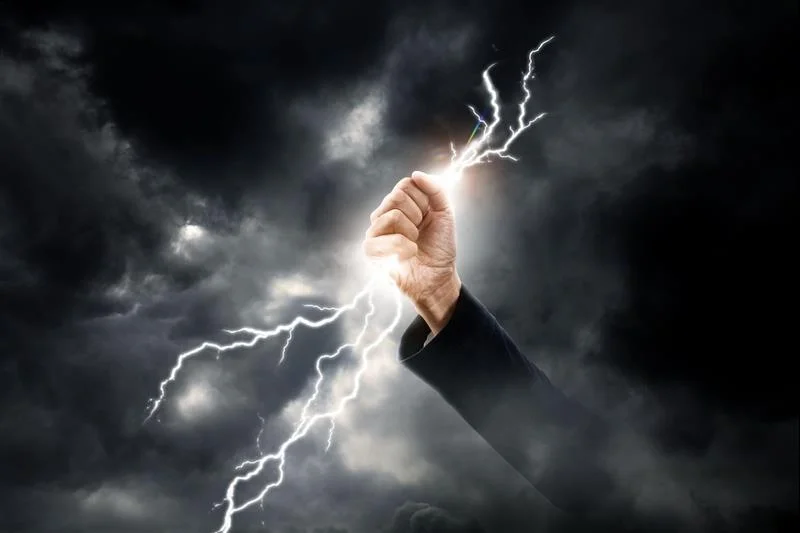 hand clenching lightning flash