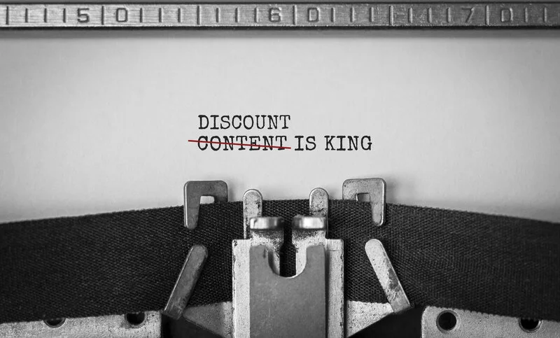 discount is king typed on an old typewriter